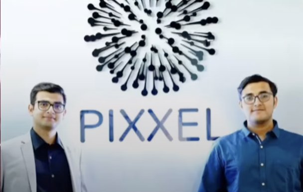 Pixxel founders in front of the Pixxel logo